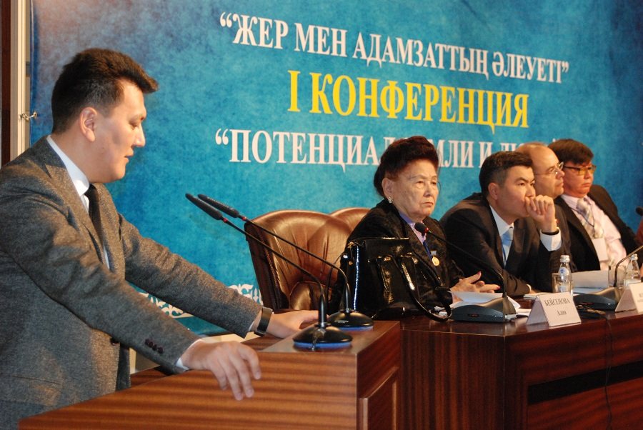 Speaking at the podium before the conference presidium